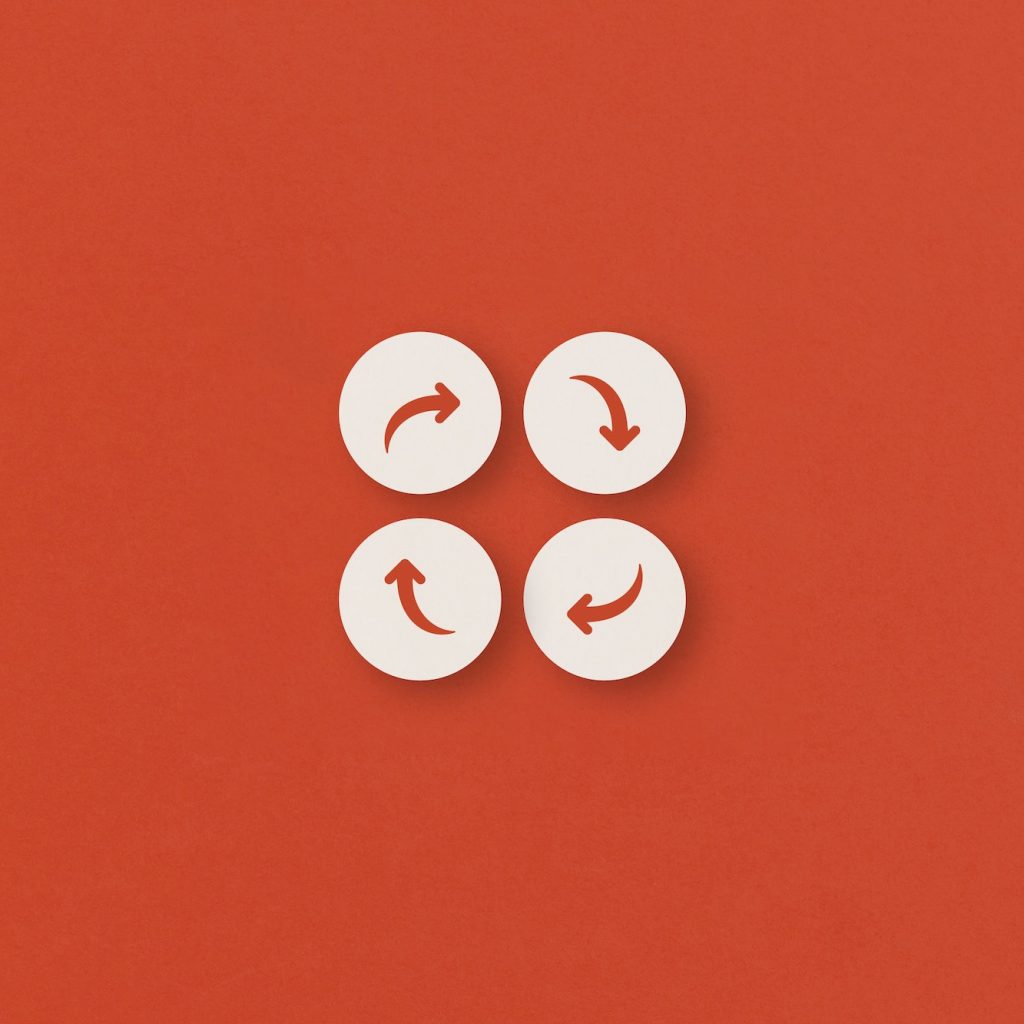 Arrows cycle concept on red background.