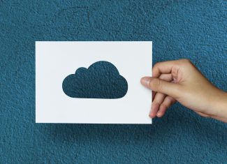 Hand Hold Cloud Paper Carving with Blue Background